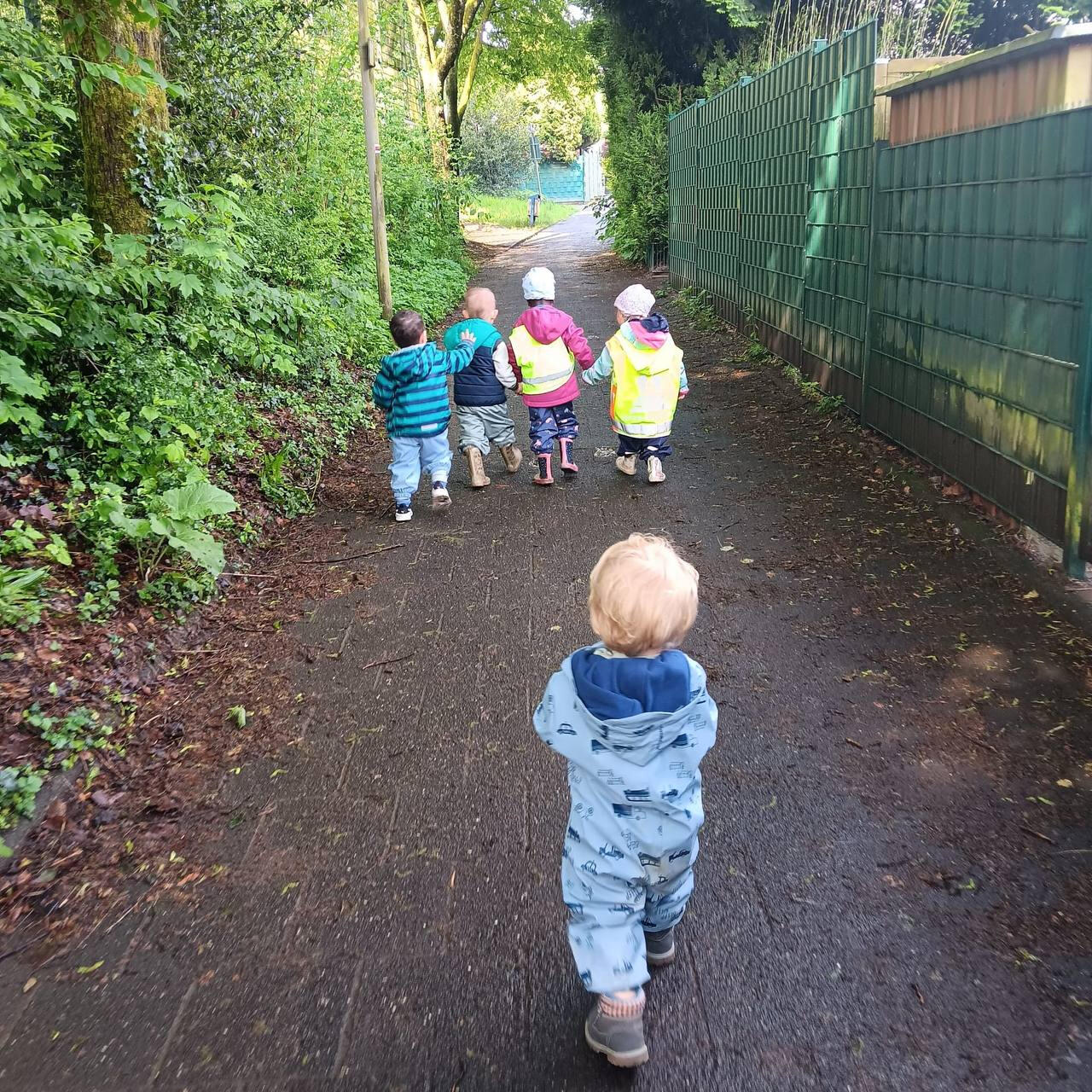 Hakuna Matata children walking together Hakuna Matata children outside walking together holding hands.